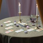 tarot cards and a crystal ball on the table
